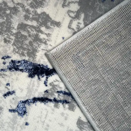 Ivory and Blue Abstract Area Rug Photo 9