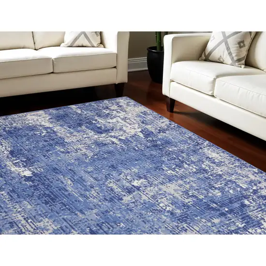 Ivory and Blue Abstract Distressed Area Rug Photo 1