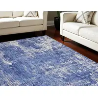 Photo of Ivory and Blue Abstract Distressed Area Rug