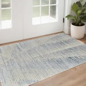 Photo of Ivory and Blue Abstract Hand Knotted Worn Faded Area Rug