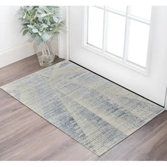 Ivory and Blue Abstract Hand Knotted Worn Faded Area Rug Photo 1