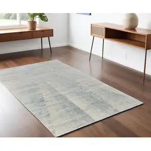 Photo of Ivory and Blue Abstract Hand Knotted Worn Faded Area Rug