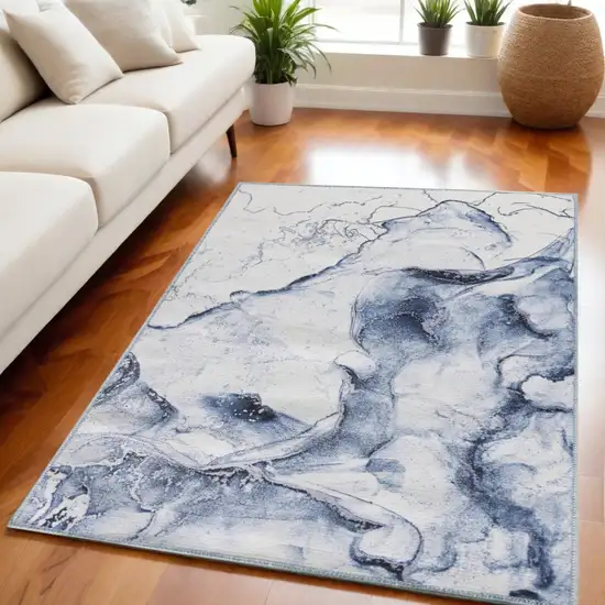 Ivory and Blue Abstract Power Loom Area Rug Photo 1