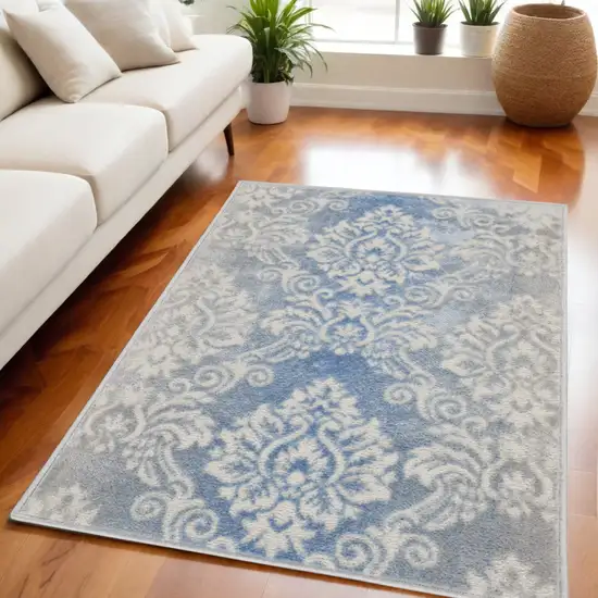 Ivory and Blue Damask Distressed Non Skid Area Rug Photo 1