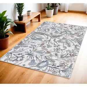 Photo of Ivory and Blue Floral Power Loom Washable Non Skid Area Rug