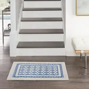 Photo of Ivory and Blue Geometric Area Rug