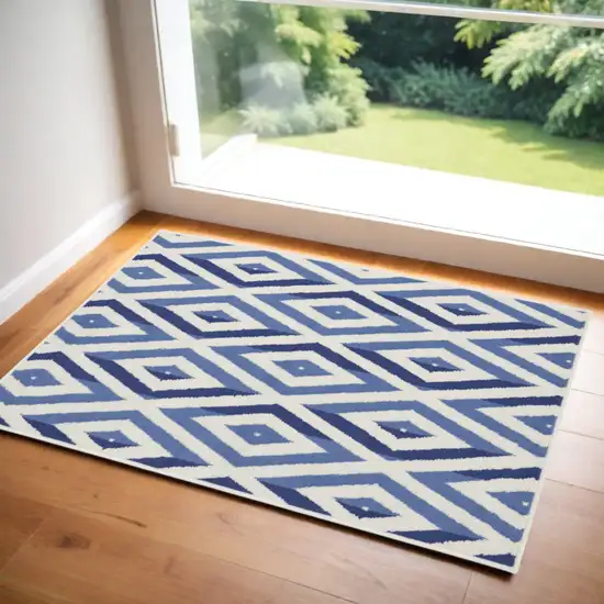 Ivory and Blue Geometric Area Rug Photo 1