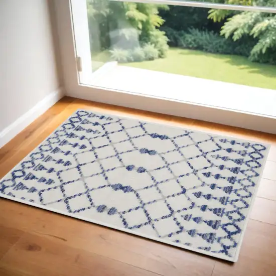 Ivory and Blue Geometric Area Rug Photo 1