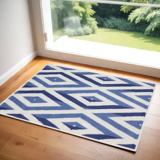 Ivory and Blue Geometric Area Rug Photo 1