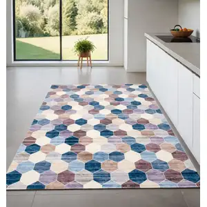 Photo of Ivory and Blue Geometric Distressed Area Rug