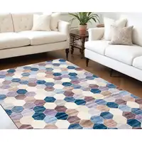 Photo of Ivory and Blue Geometric Distressed Area Rug