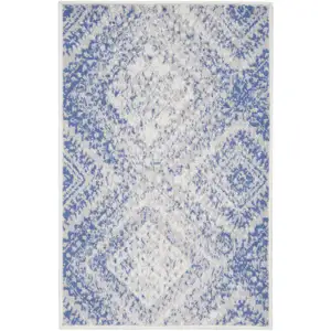 Photo of Ivory and Blue Geometric Distressed Area Rug