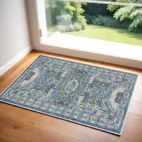 Photo of Ivory and Blue Geometric Distressed Non Skid Area Rug