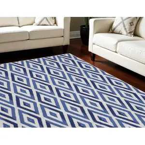 Photo of Ivory and Blue Geometric Distressed Non Skid Area Rug