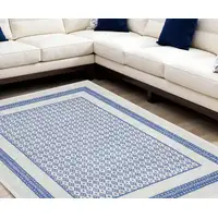 Photo of Ivory and Blue Geometric Distressed Non Skid Area Rug