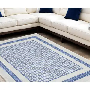 Photo of Ivory and Blue Geometric Distressed Non Skid Area Rug