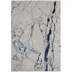 Photo of Ivory and Blue Marble Power Loom Distressed Area Rug