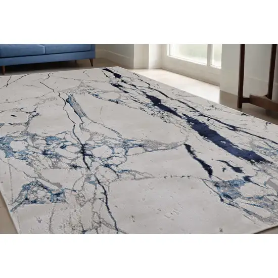 Ivory and Blue Marble Power Loom Distressed Area Rug Photo 1