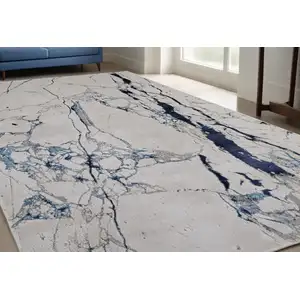 Photo of Ivory and Blue Marble Power Loom Distressed Area Rug