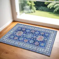 Photo of Ivory and Blue Oriental Distressed Non Skid Area Rug