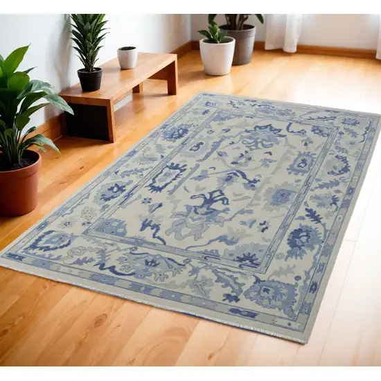 Ivory and Blue Wool Floral Hand Knotted Area Rug With Fringe Photo 1