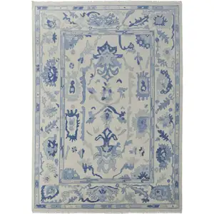 Photo of Ivory and Blue Wool Floral Hand Knotted Area Rug With Fringe