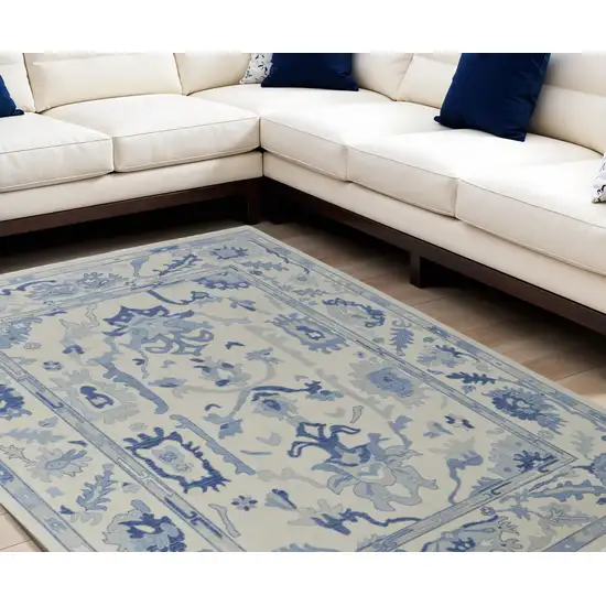 Ivory and Blue Wool Floral Hand Knotted Area Rug With Fringe Photo 1