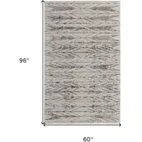 Photo of Ivory and Brown Geometric Power Loom Area Rug