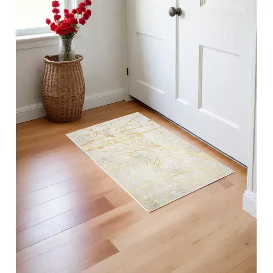 Ivory and Gold Abstract Area Rug Photo 2