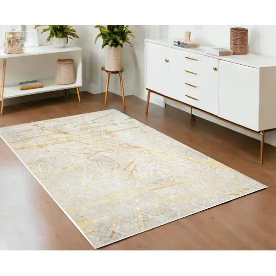 Ivory and Gold Abstract Area Rug Photo 2