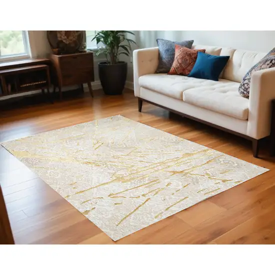 Ivory and Gold Abstract Area Rug Photo 2