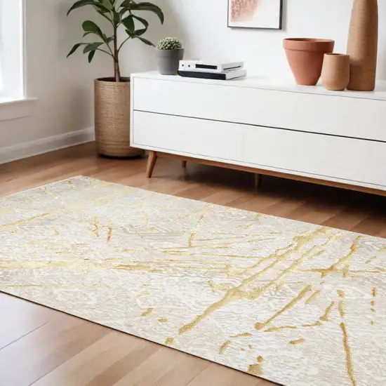 Ivory and Gold Abstract Area Rug Photo 2