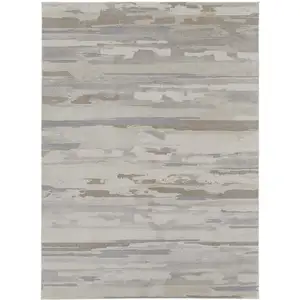 Photo of Ivory and Gray Abstract Power Loom Distressed Area Rug