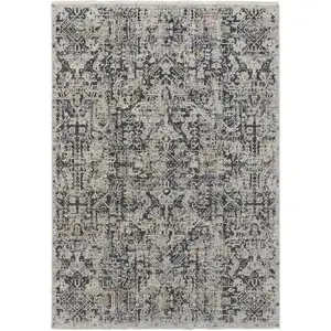 Photo of Ivory and Gray Abstract Power Loom Worn Faded Area Rug With Fringe