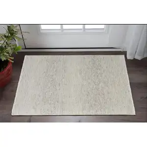 Photo of Ivory and Gray Wool Hand Knotted Area Rug With Fringe