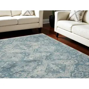 Photo of Ivory and Light Blue Geometric Distressed Area Rug