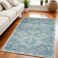 Photo of Ivory and Light Blue Medallion Distressed Area Rug