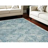 Photo of Ivory and Light Blue Medallion Distressed Area Rug