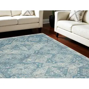 Photo of Ivory and Light Blue Medallion Distressed Area Rug