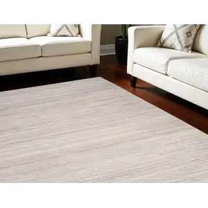 Photo of Ivory and Light Brown Abstract Washable Area Rug