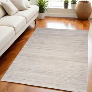 Photo of Ivory and Light Brown Abstract Washable Area Rug