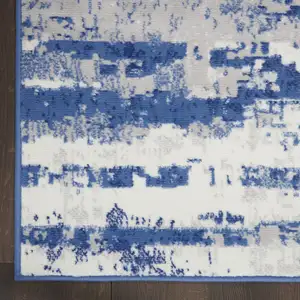 Photo of Ivory and Navy Blue Abstract Area Rug