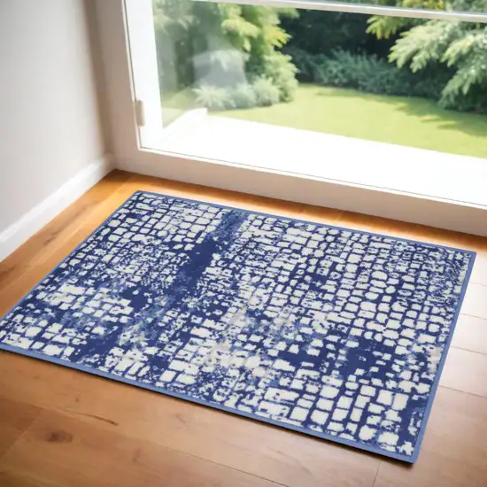 Ivory and Navy Blue Abstract Area Rug Photo 1