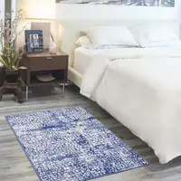 Photo of Ivory and Navy Blue Abstract Area Rug