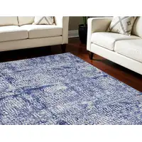 Photo of Ivory and Navy Blue Abstract Distressed Non Skid Area Rug