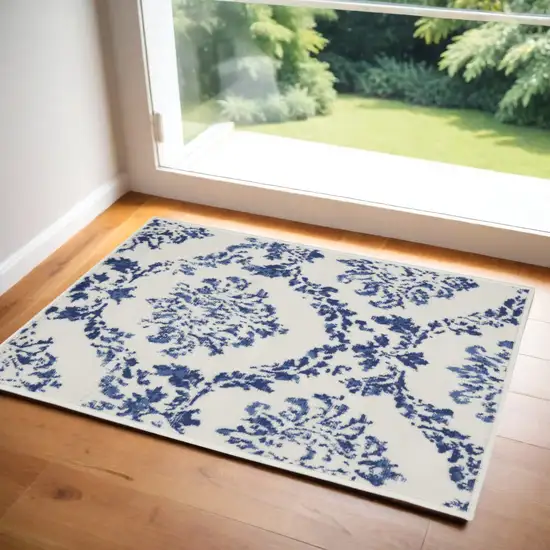 Ivory and Navy Blue Damask Distressed Area Rug Photo 1