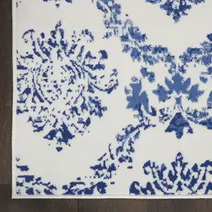 Photo of Ivory and Navy Blue Damask Distressed Non Skid Area Rug