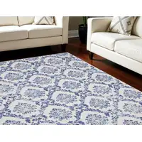 Photo of Ivory and Navy Blue Damask Distressed Non Skid Area Rug