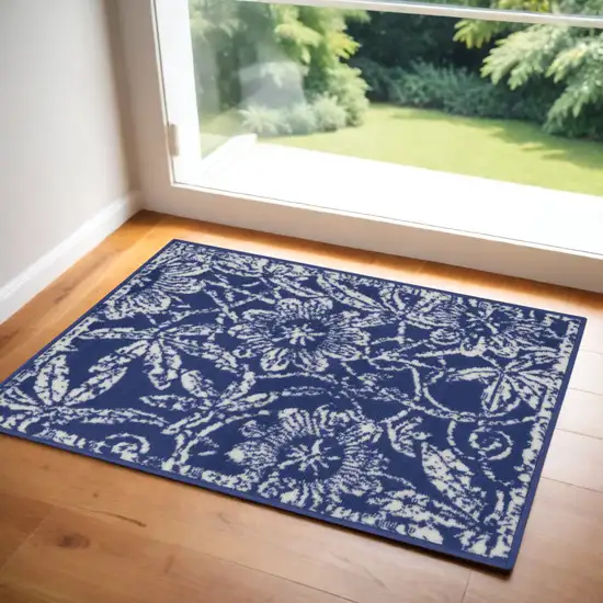 Ivory and Navy Blue Floral Distressed Area Rug Photo 1