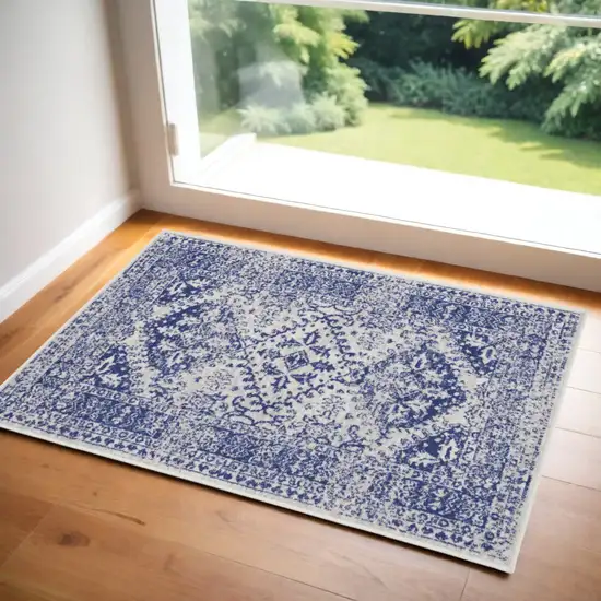 Ivory and Navy Blue Geometric Distressed Area Rug Photo 1